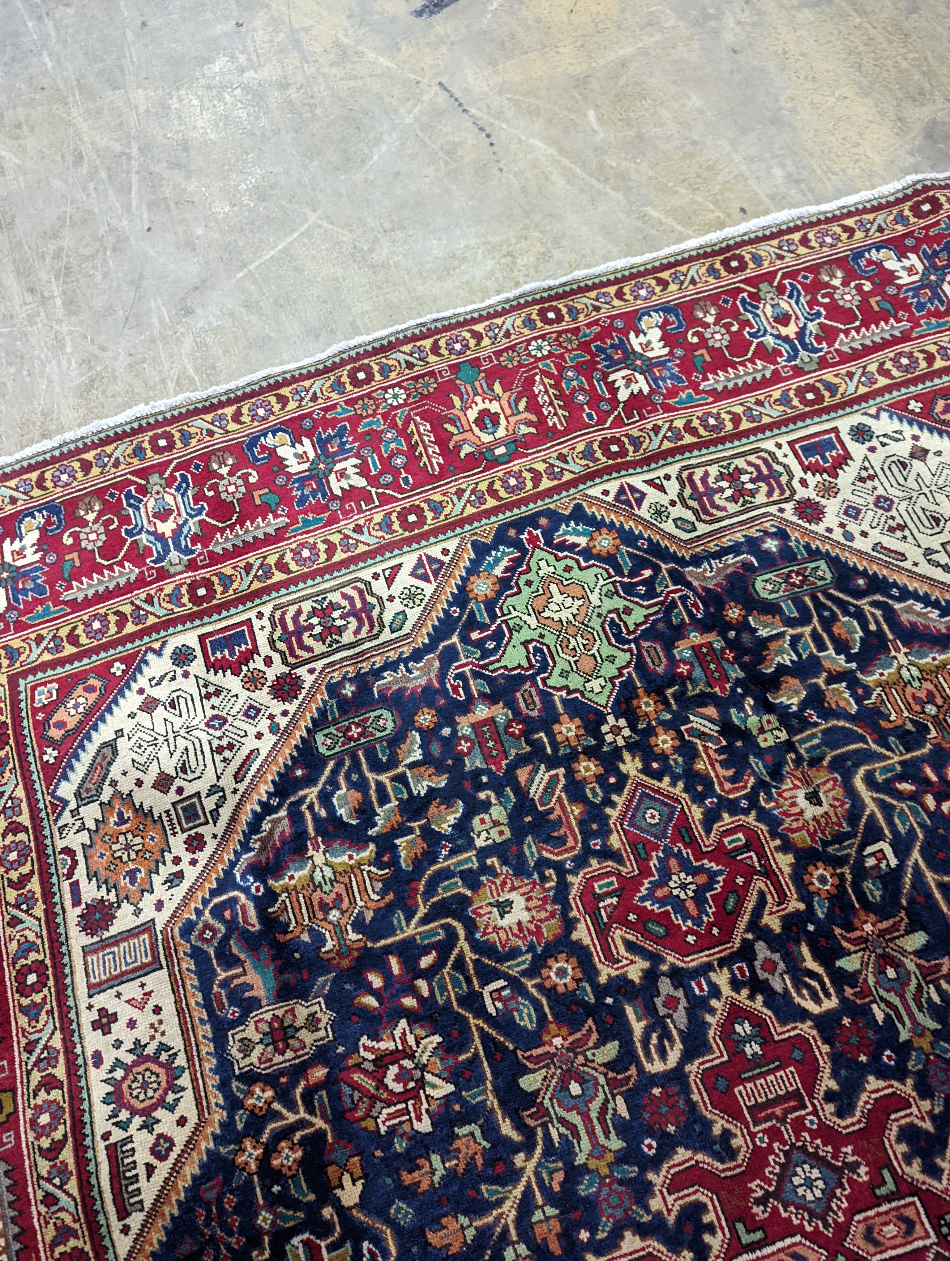 A Tabriz blue ground carpet, 290 x 200cm